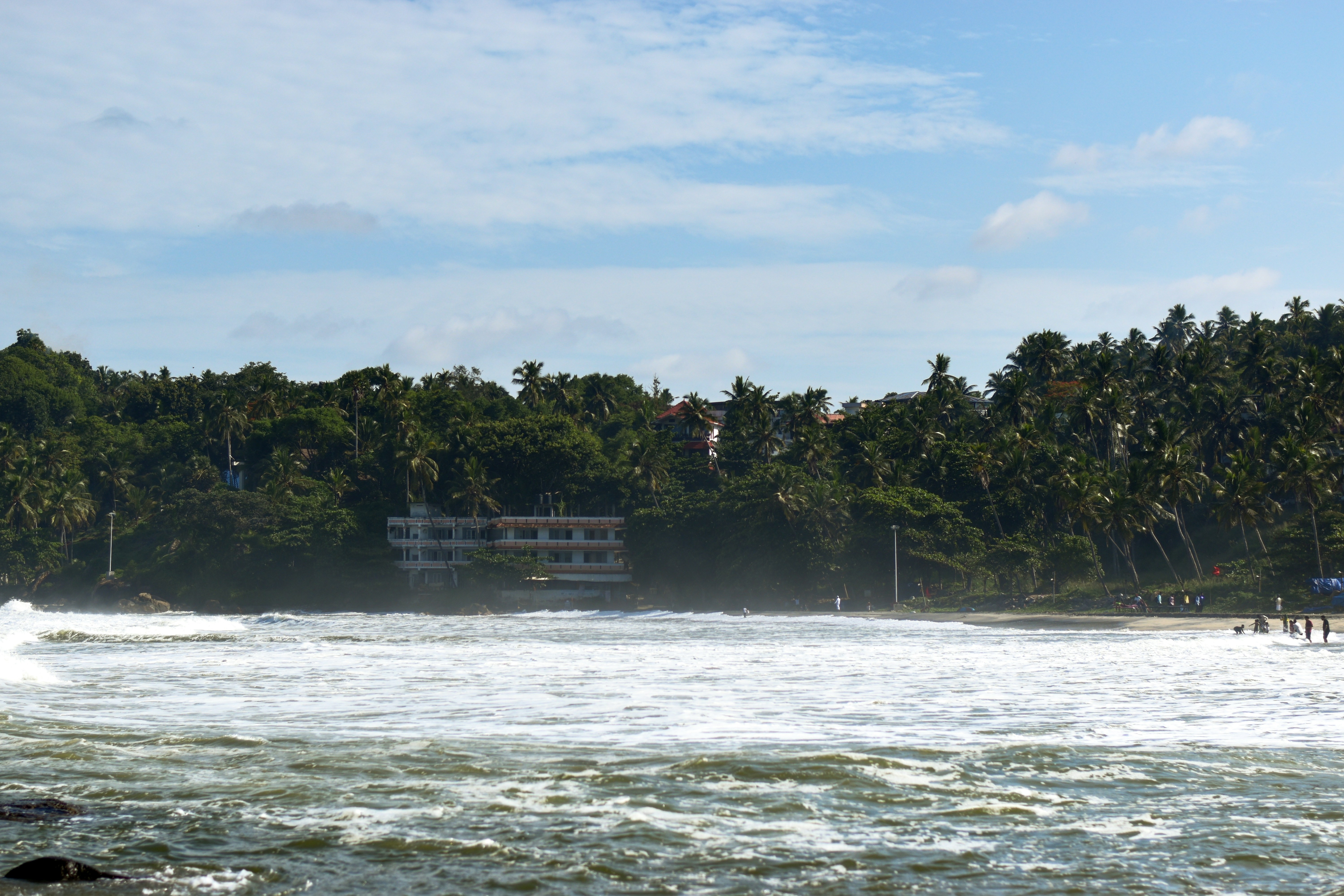 Kerala Backwaters, India - Kovalam Beach Kovalam is an internationally renowned beach with three adjacent crescent beaches. It has been a favourite haunt of tourists since the 1930s. A massive rocky promontory on the beach has created a beautiful bay of calm waters ideal for sea bathing. The leisure options at this beach are plenty and diverse.