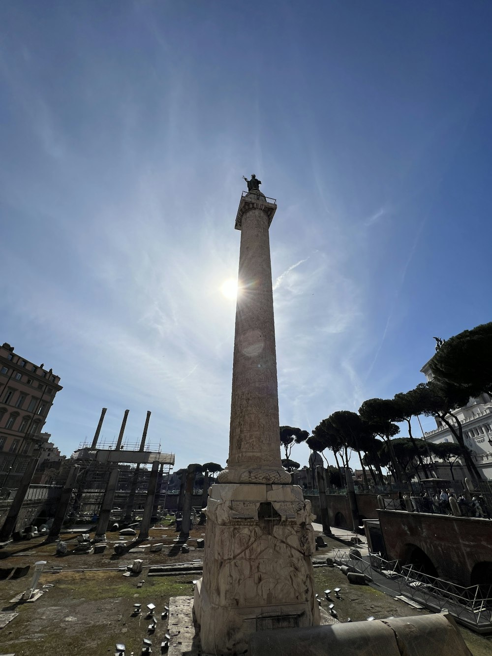 the sun shines brightly over the ruins of a city