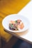 a white plate topped with food on top of a table
