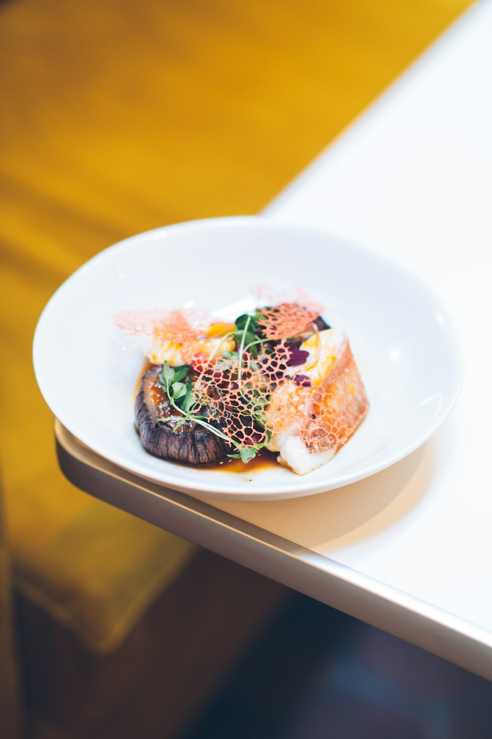 a white plate topped with food on top of a table