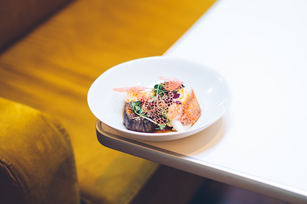 a plate of food sitting on top of a table