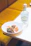 Elegant plated French cuisine with vibrant Mediterranean colors at a private dining table.