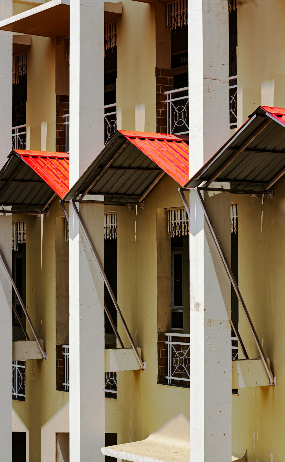 a row of buildings with red roof tops