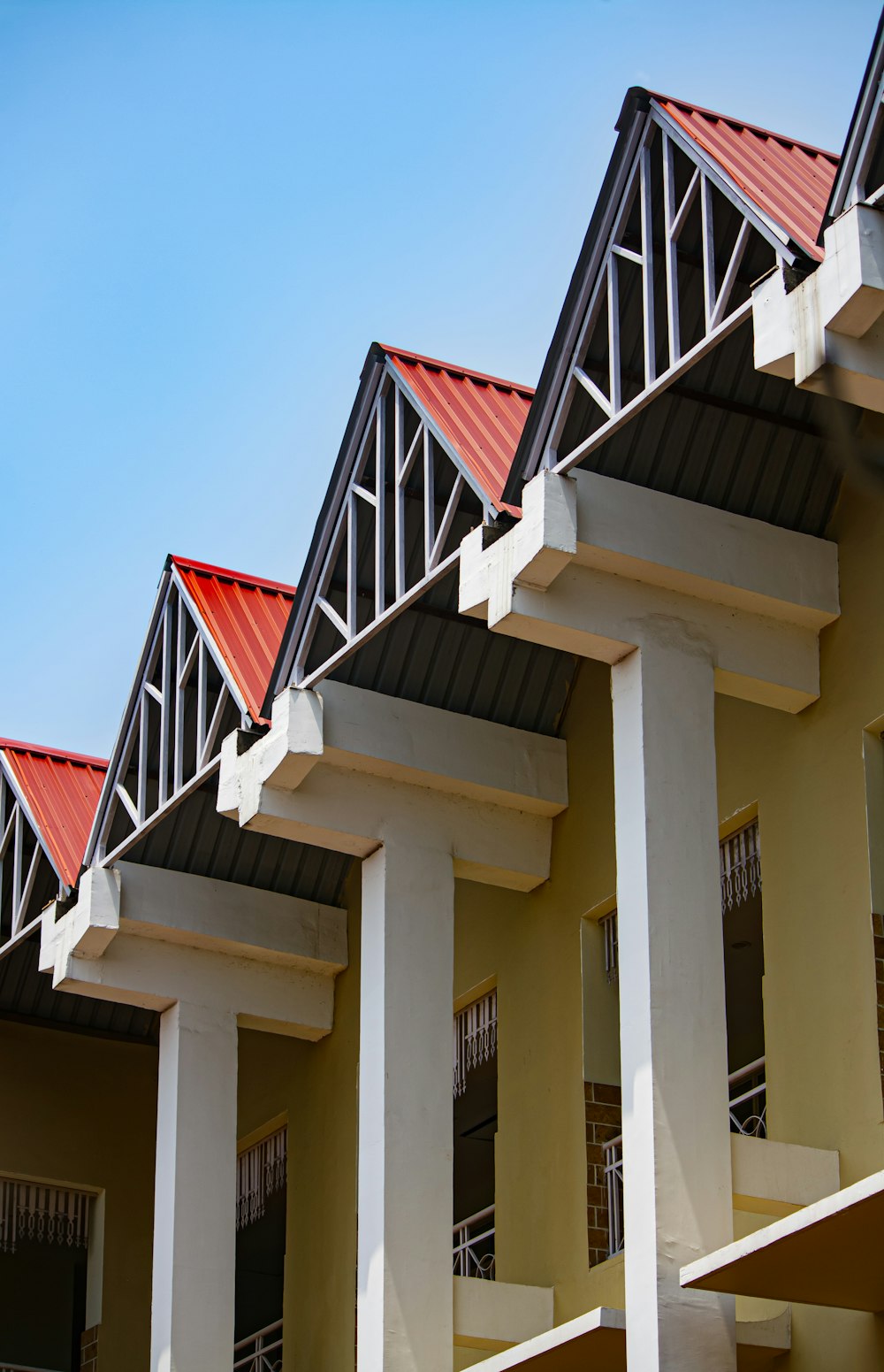 a row of buildings with red roof tops