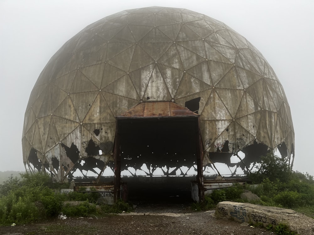 a large dome structure sitting on top of a hill