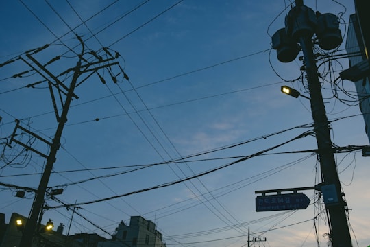 A network of smart meters and digital energy management systems glowing in a cityscape at dusk.