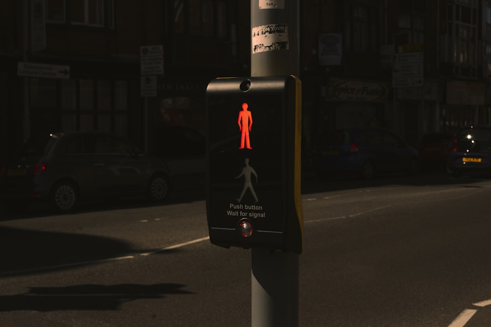 a pedestrian crossing sign on a city street