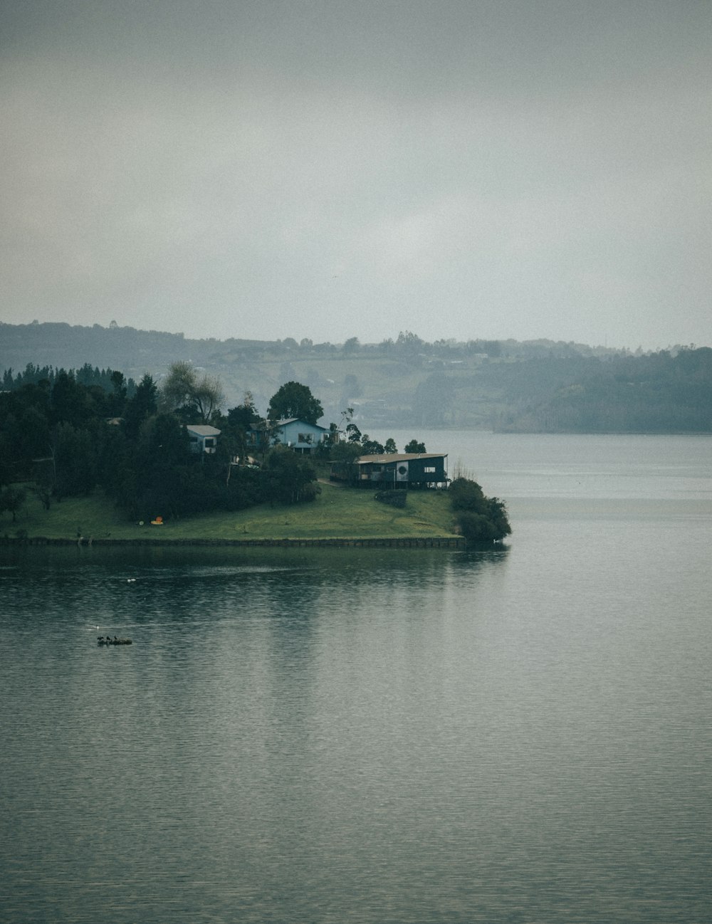 a body of water with a small island in the middle of it