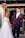 a bride and groom are walking through bubbles