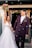 a bride and groom are walking through bubbles