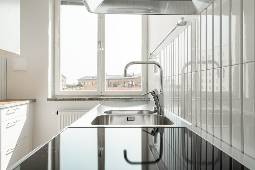 a kitchen with a sink and a window