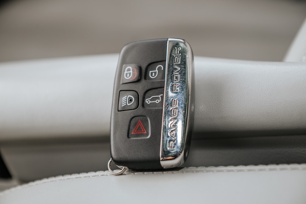 a close up of a remote control on a car