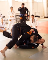 a group of people in a gym doing karate