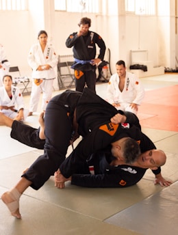 a group of people in a gym doing karate