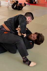 Sensei Milico demonstrating a jiu-jitsu technique with a focused expression.