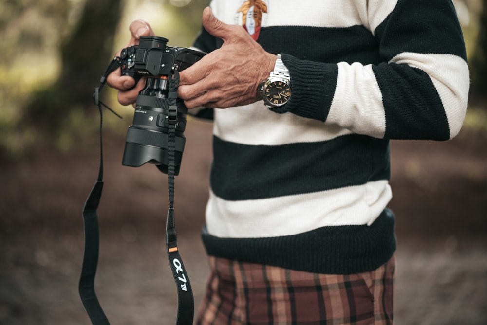 a man holding a camera in his hands