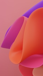 a close up of a cell phone with a pink background