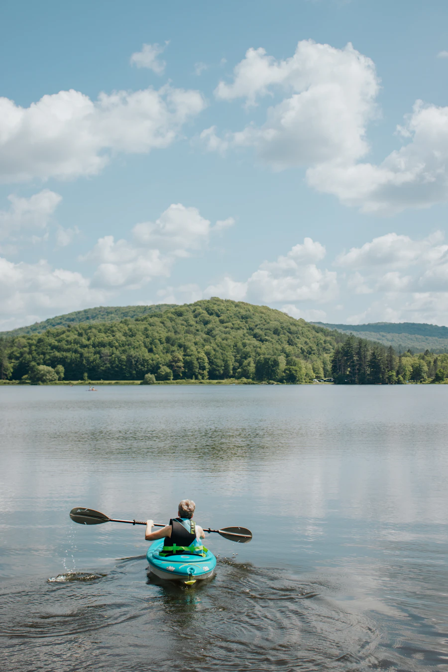 Kayak resting on a calm lake, the kind of trip where gear gets tested for real waterproofing