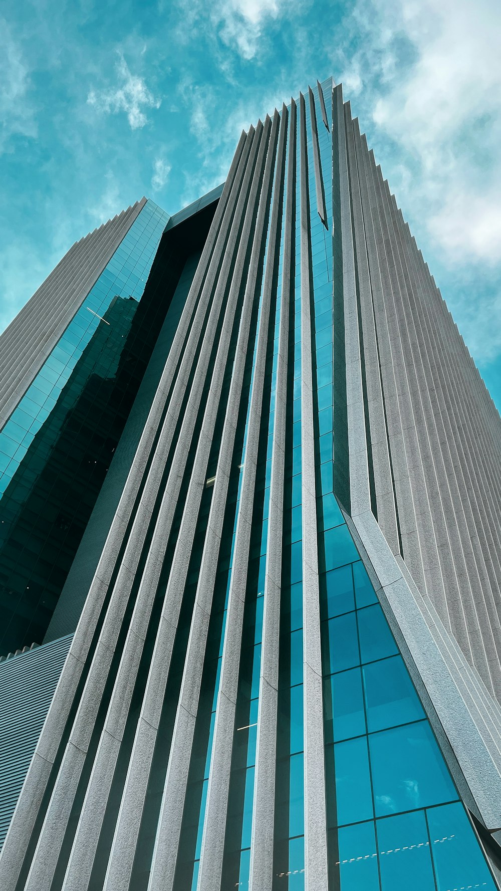 a very tall building with a sky background