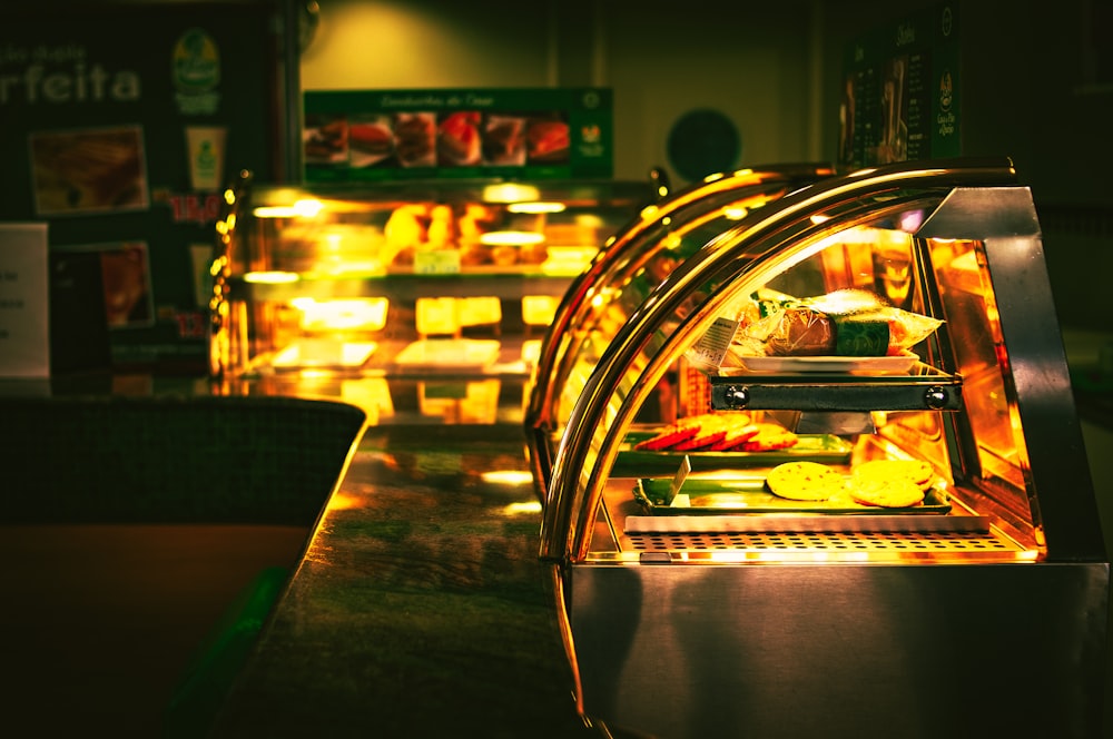 a display case in a restaurant filled with food