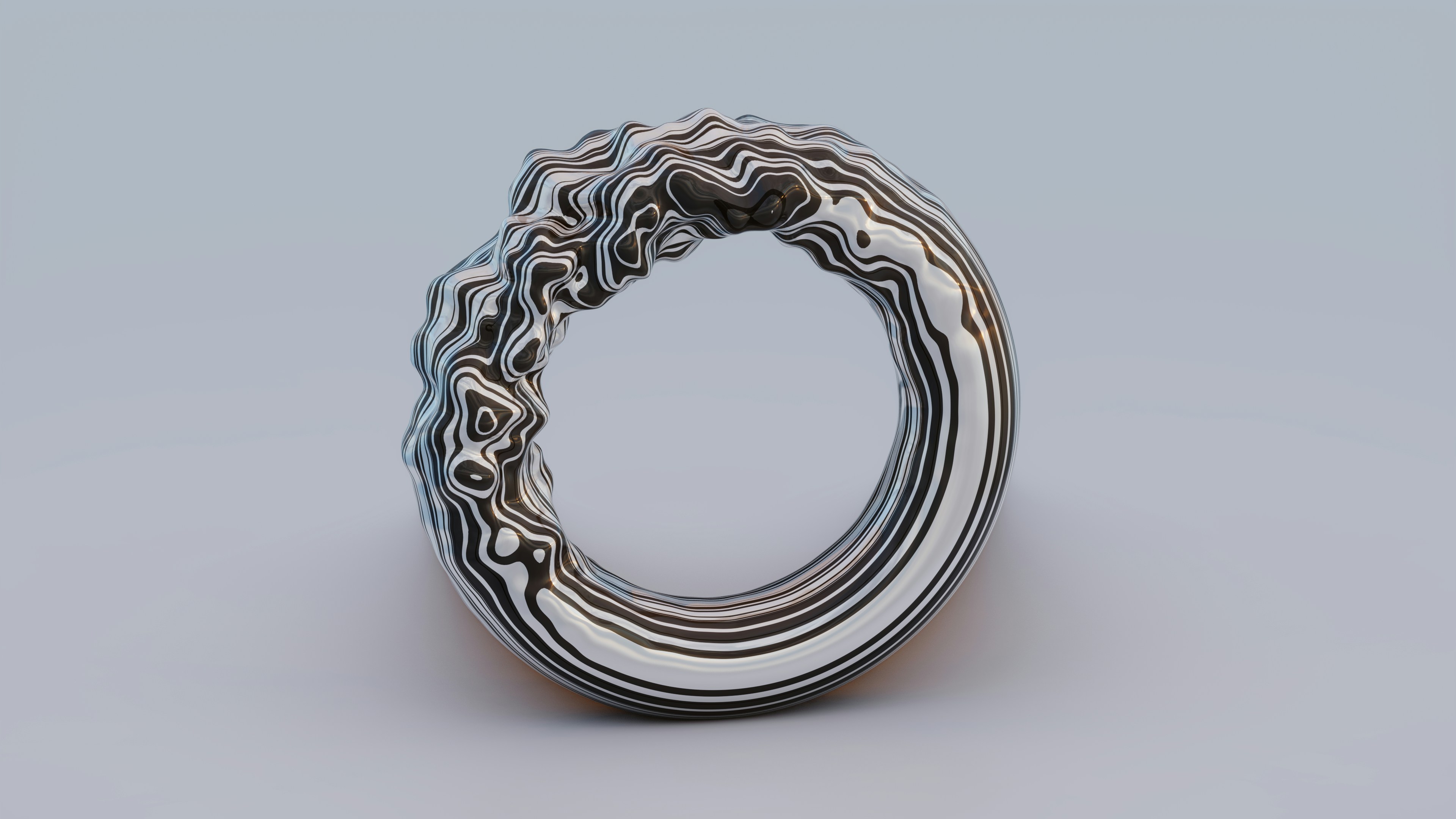 A zebra-colored torus being liquified. Orthographic perspective, Eevee in Blender.