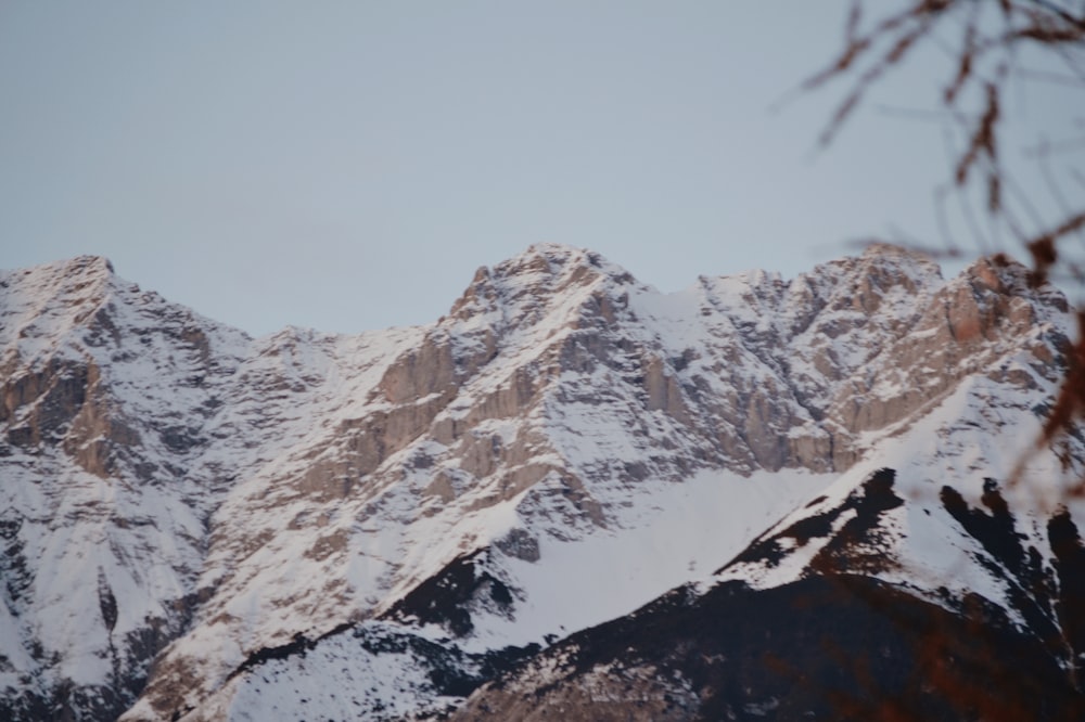 a view of a snowy mountain range from a distance