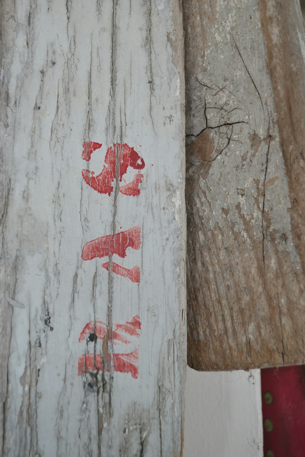 a close up of a piece of wood with writing on it