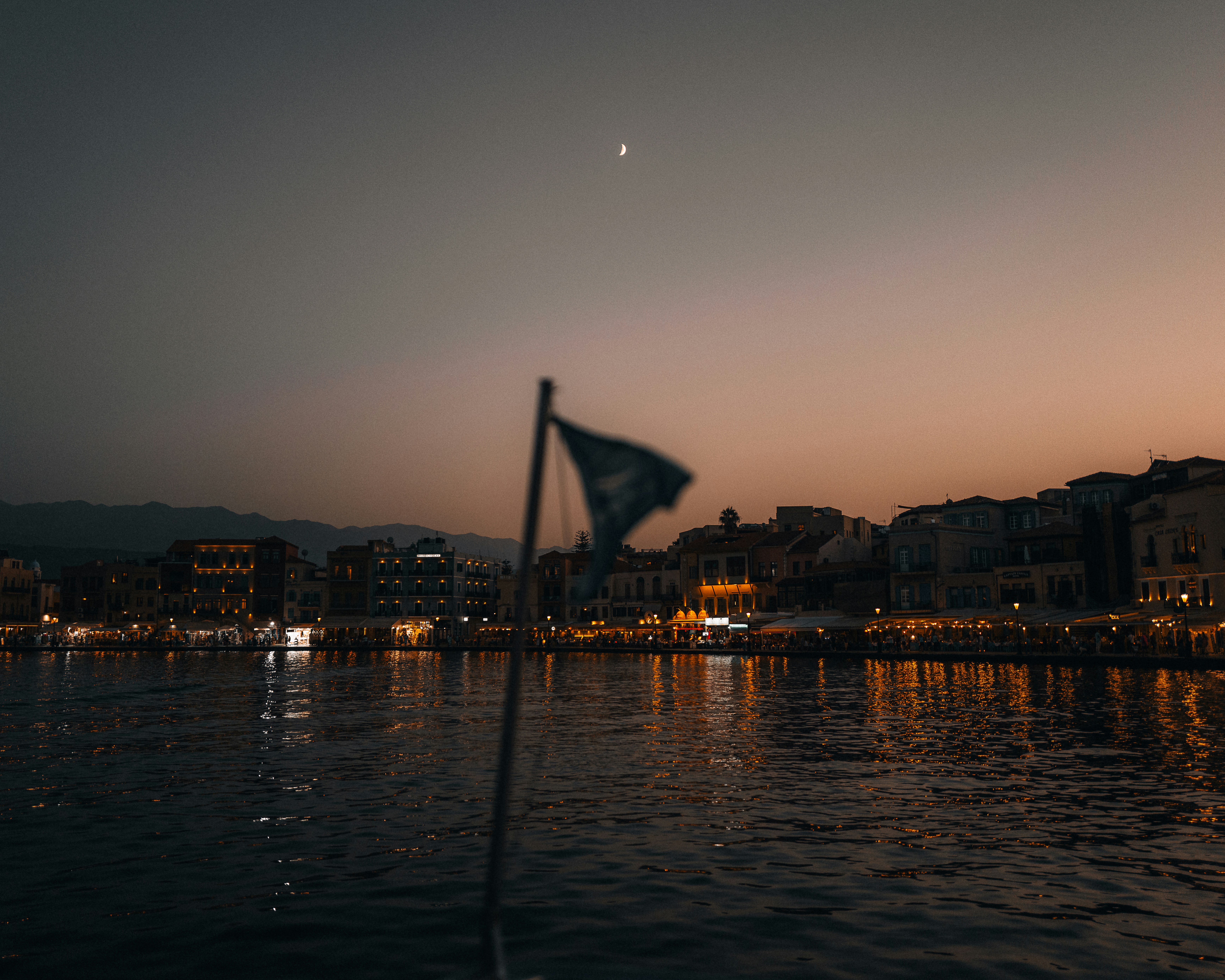 a view of a body of water with buildings in the background
