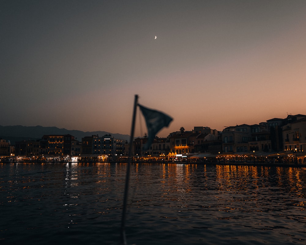 a view of a body of water with buildings in the background