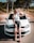 a woman sitting on the hood of a car