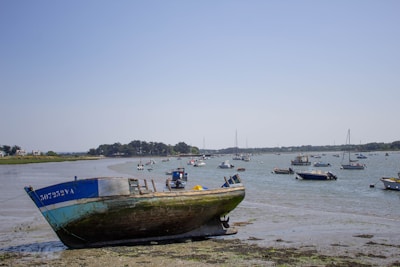a group of boats floating on top of a body of water