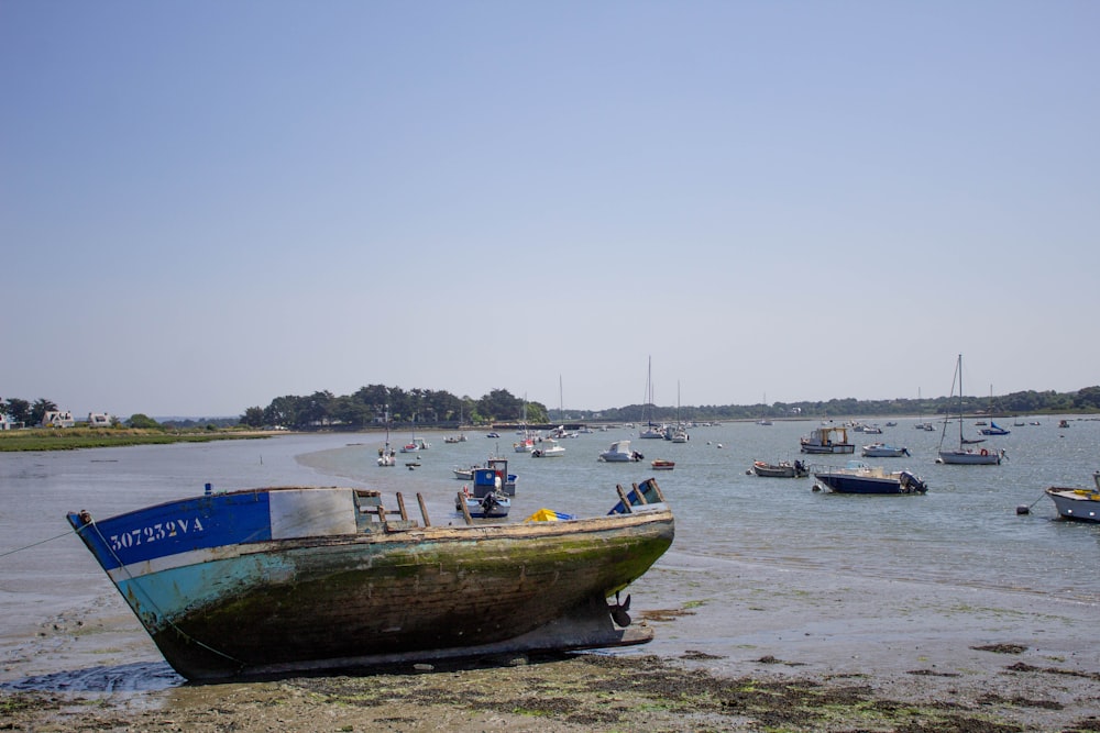 a group of boats floating on top of a body of water