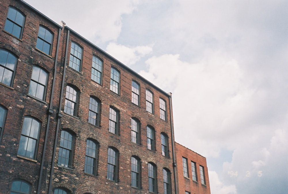 a tall brick building with lots of windows