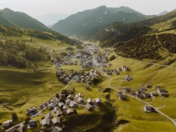 an aerial view of a village in the mountains