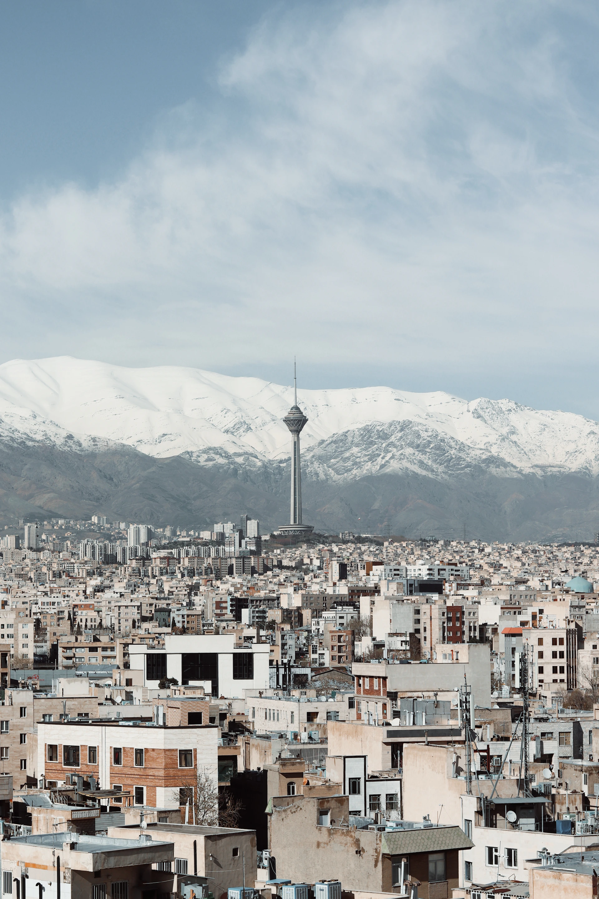 a view of a city with mountains in the background