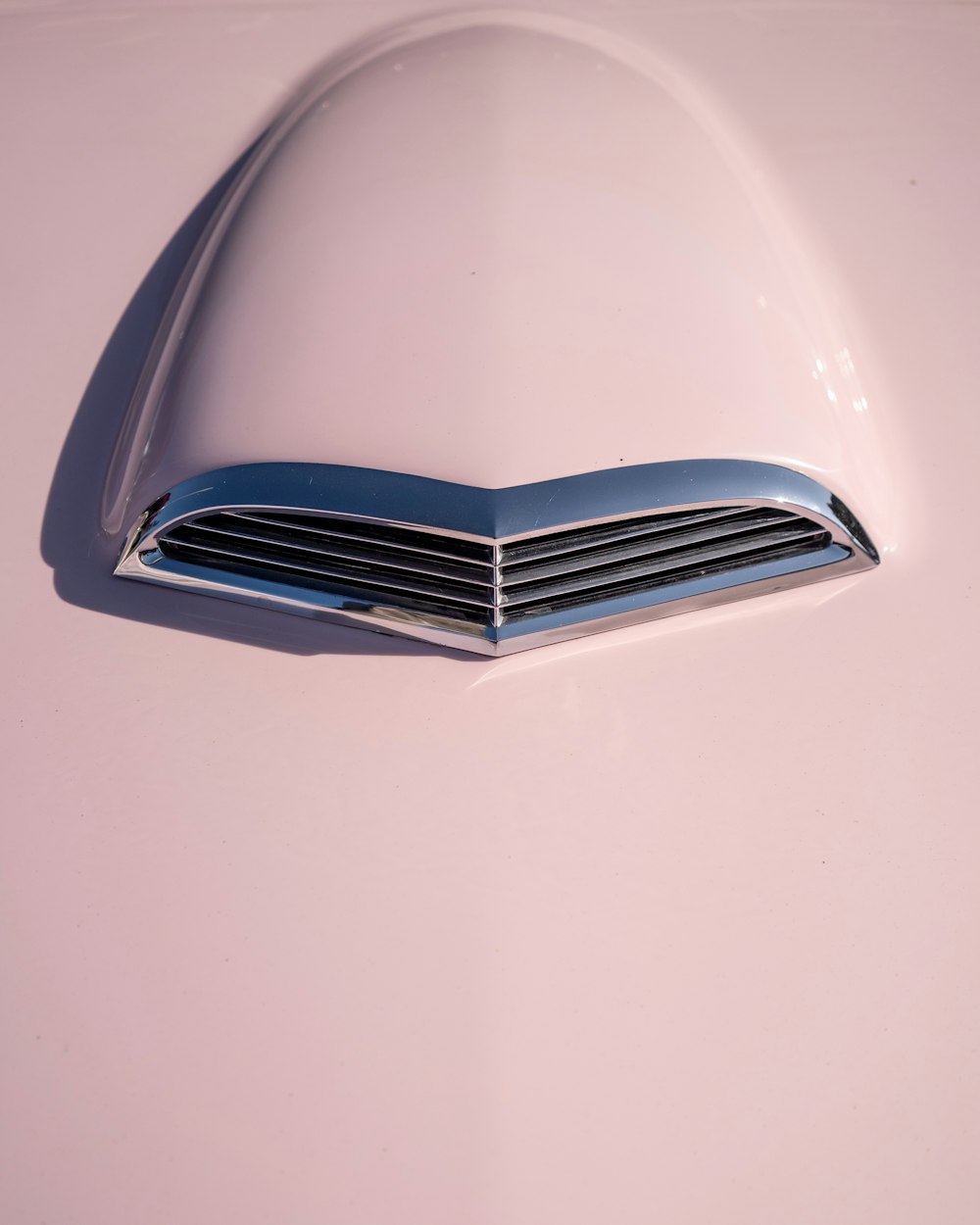 a close up of the hood ornament of a classic car