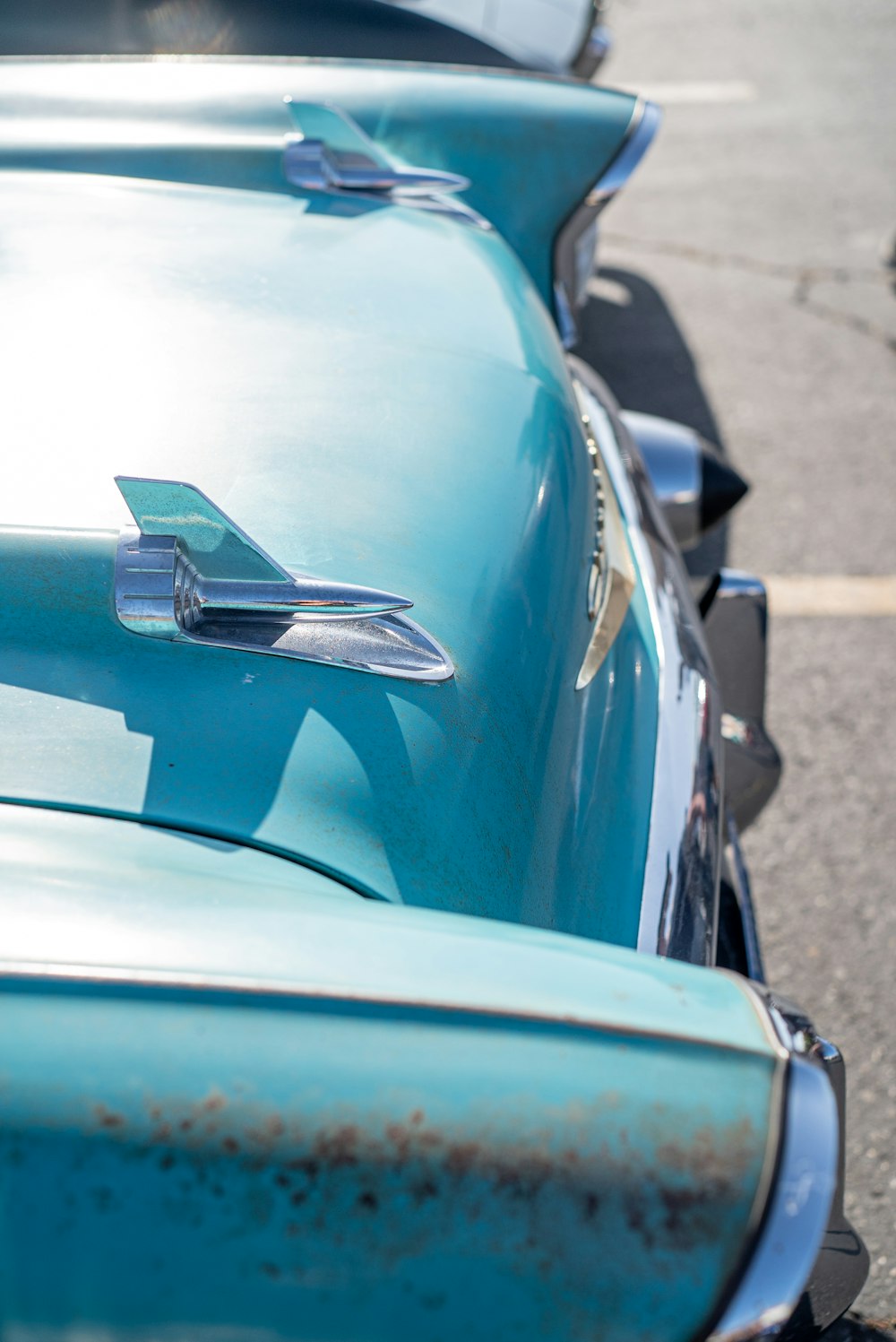 a row of old cars parked next to each other