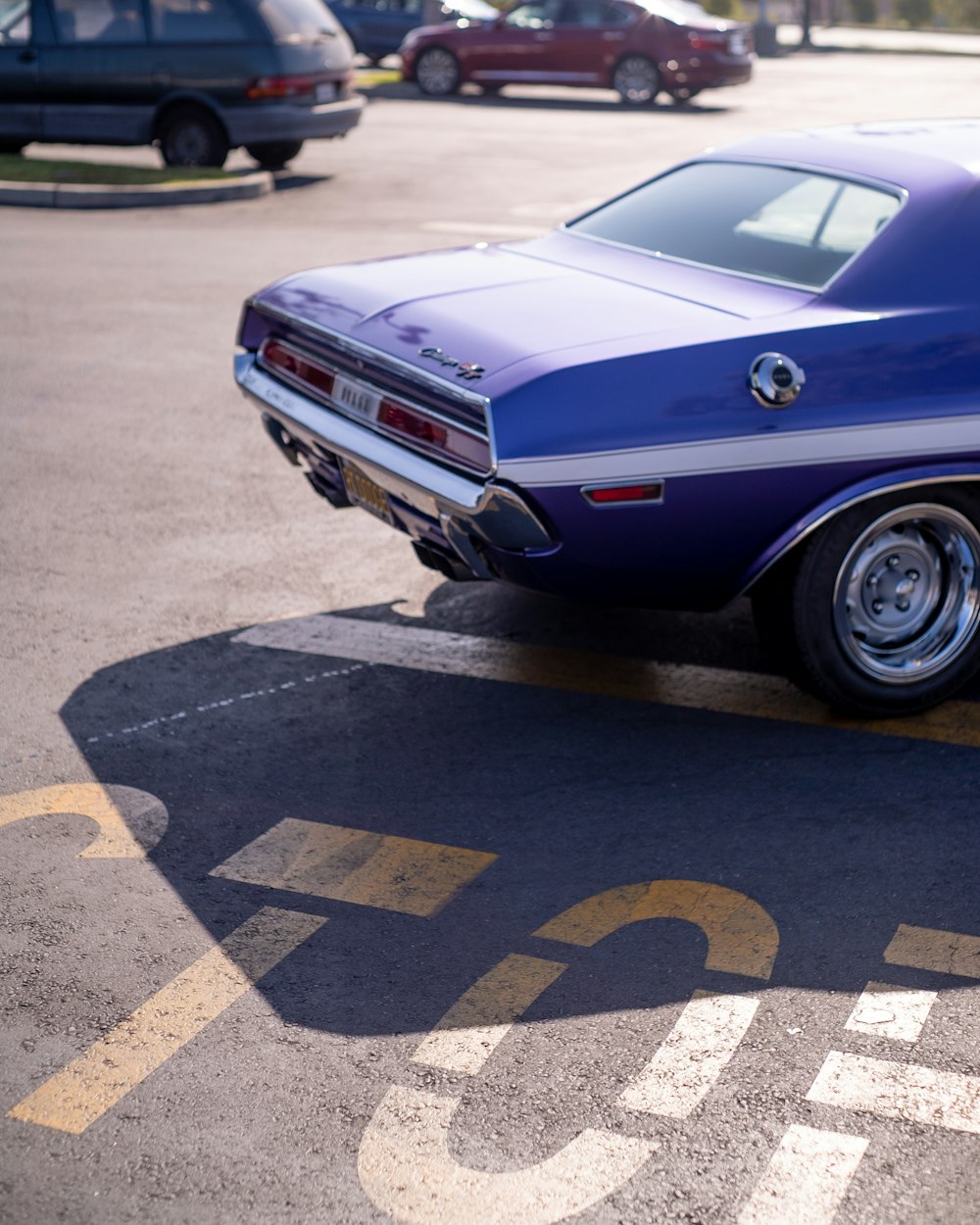 a blue car parked in a parking lot