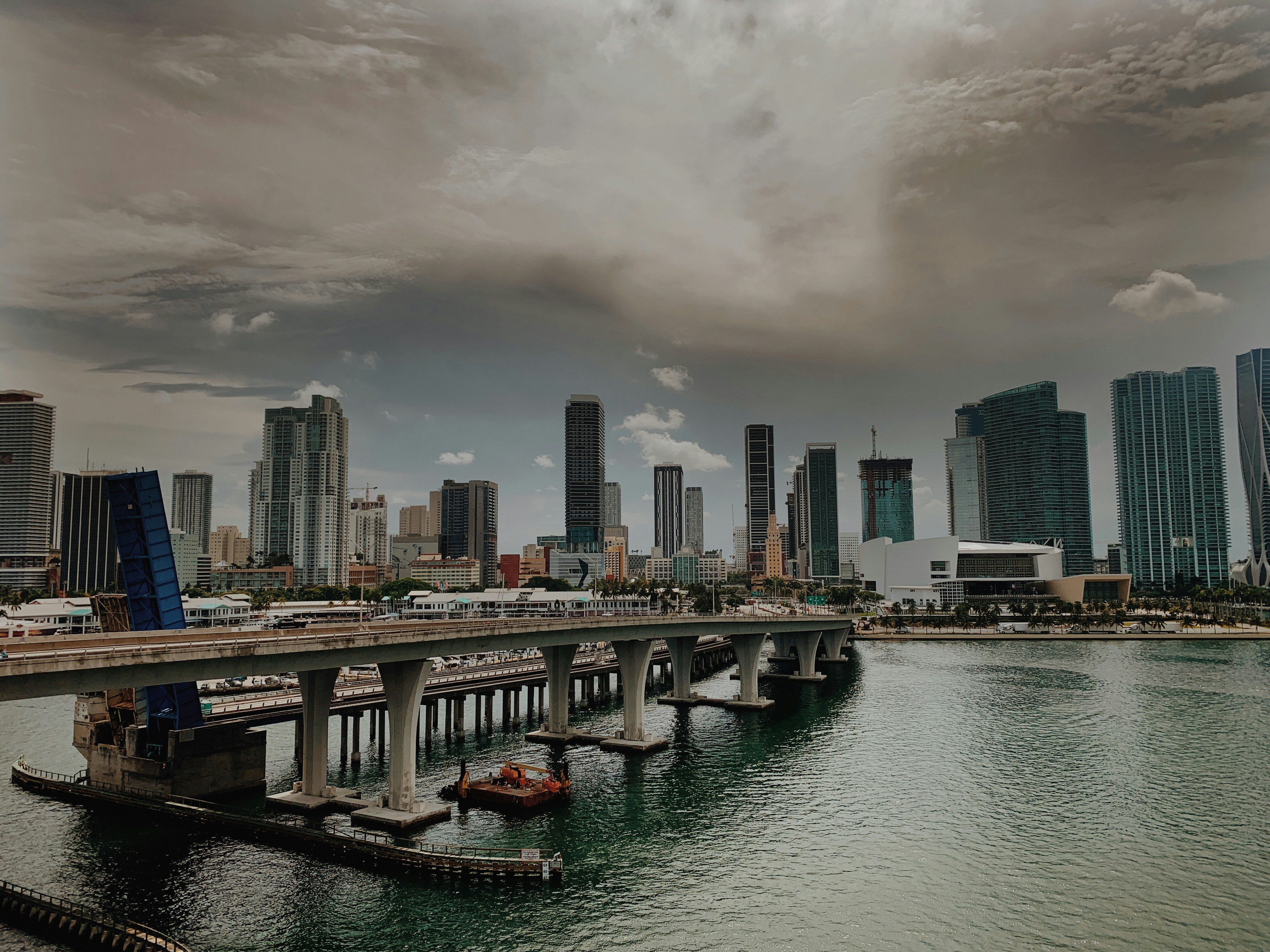 a large bridge over a large body of water, Looking back at the city from aboard the cruise ship.
