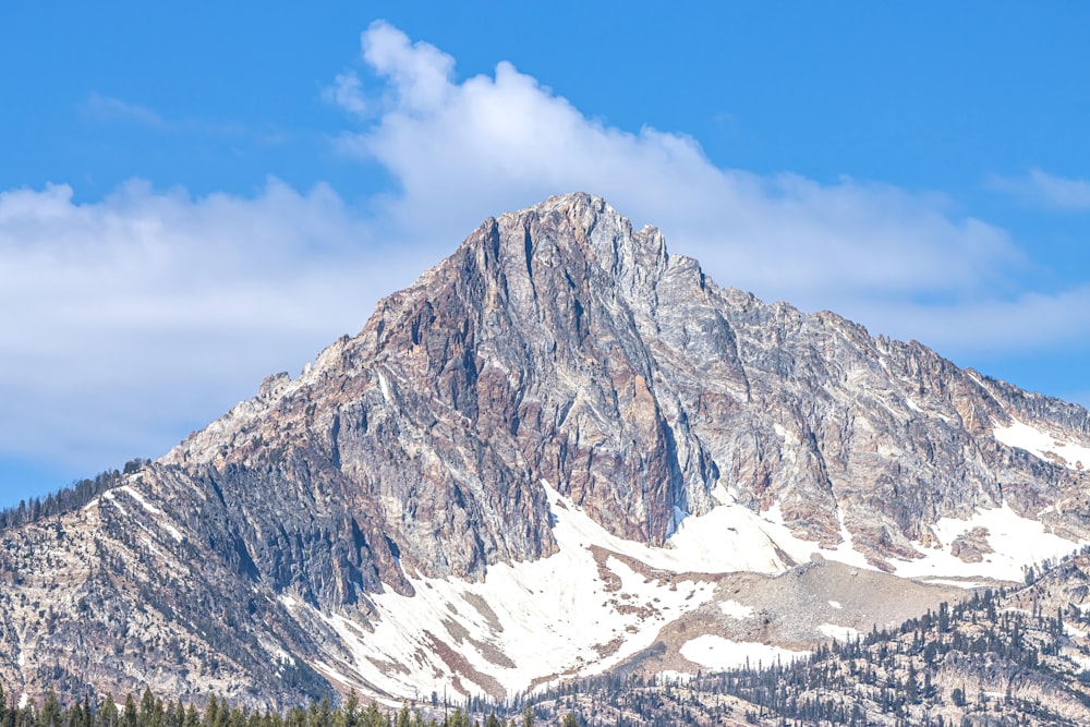 a very tall mountain with snow on it