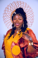 A proud young woman showcasing handmade crafts she created through Yaren Organisation’s empowerment program.