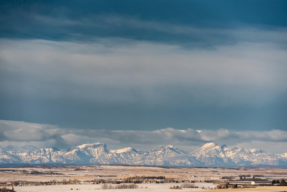 a view of a snowy mountain range in the distance