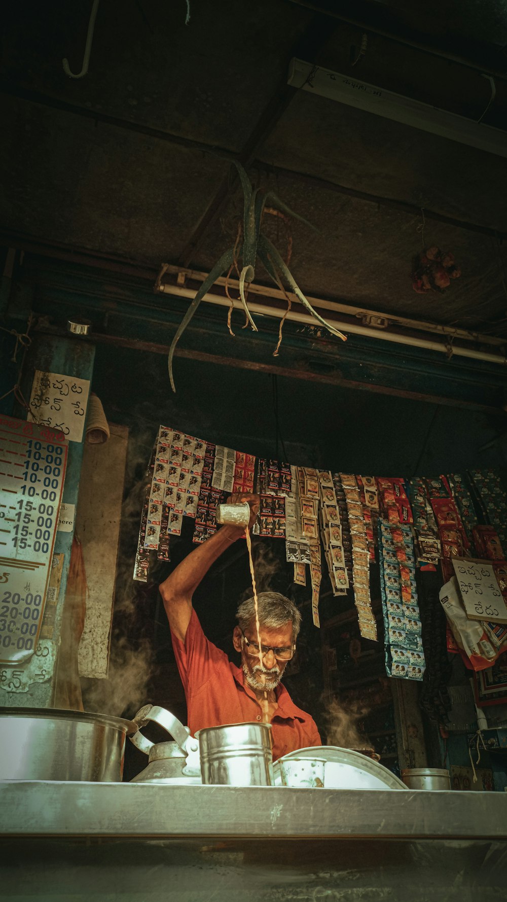 a man standing in a kitchen cooking food