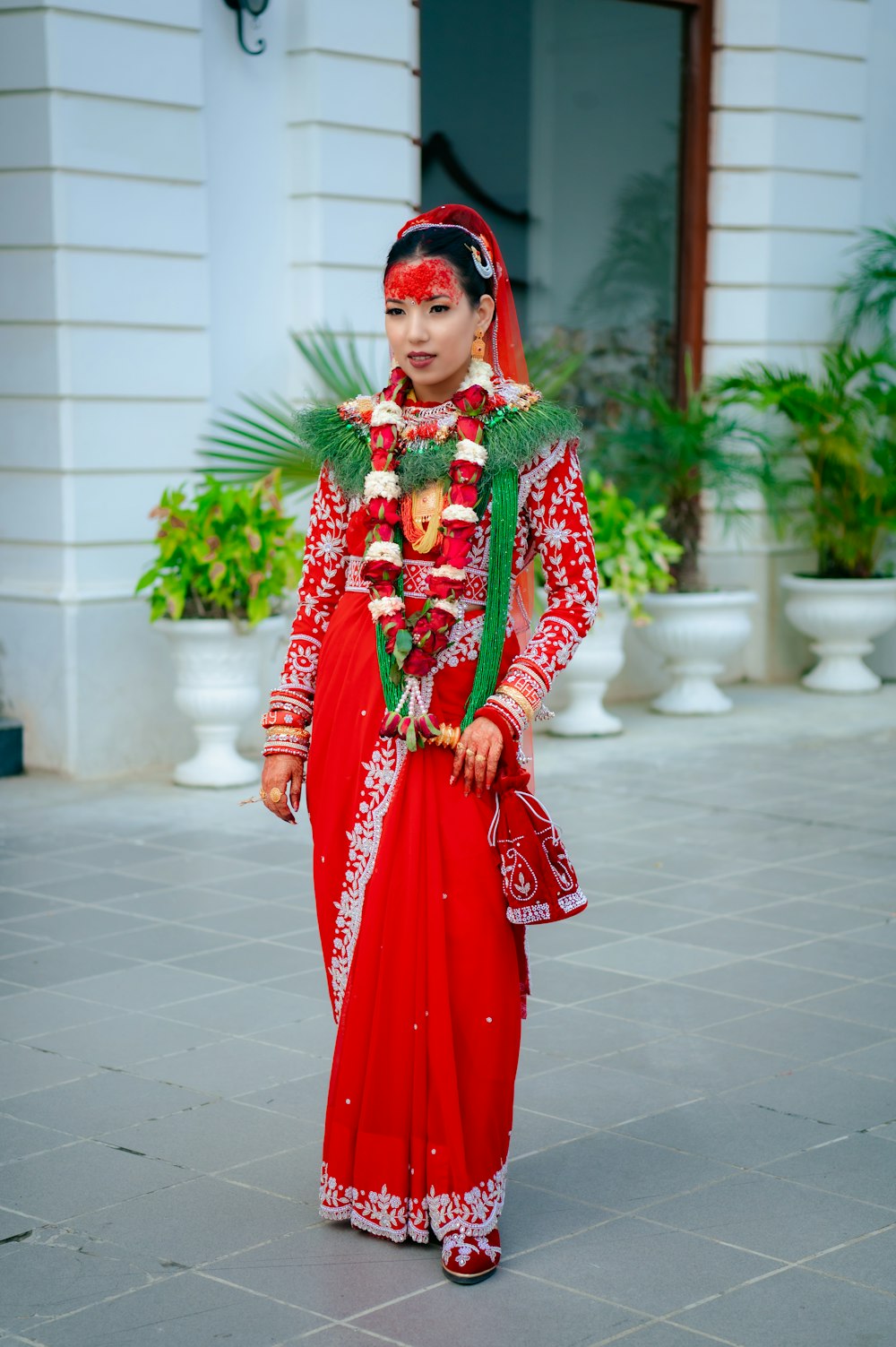 a woman dressed in a red and green outfit