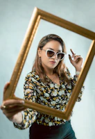 Happy businesswoman holding a framed photo from a professional shoot