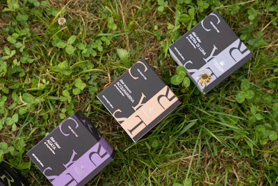 Packaging boxes of 2cmc products stacked with clear branding and modern design
