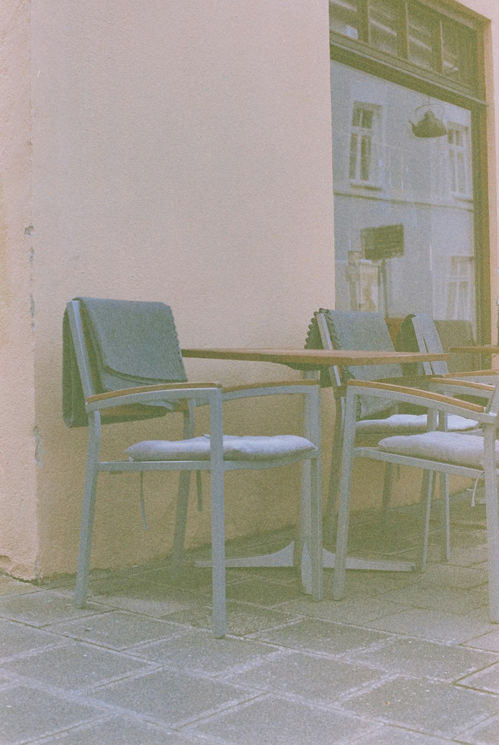 a couple of chairs sitting on top of a patio