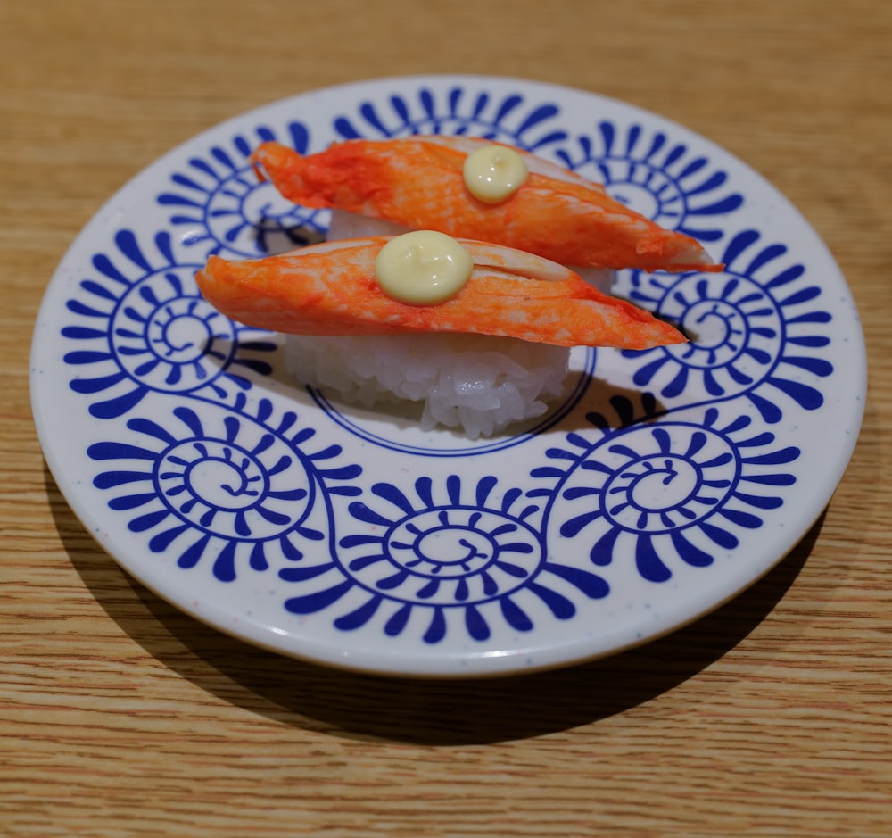 a plate of sushi on a wooden table