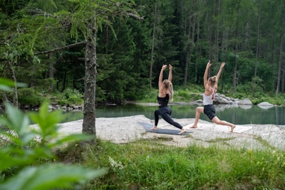 a couple of people that are standing on a rock
