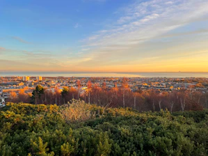 A panoramic view of Bujumbura city with Lake Tanganyika in the background at sunset.